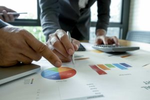 Two business professionals looking over their company before an operational audit